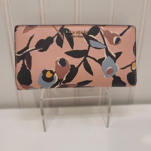 NWOT Kate Spade wallet. Pink w blue, black, yellow, brown flowers. Button snap.